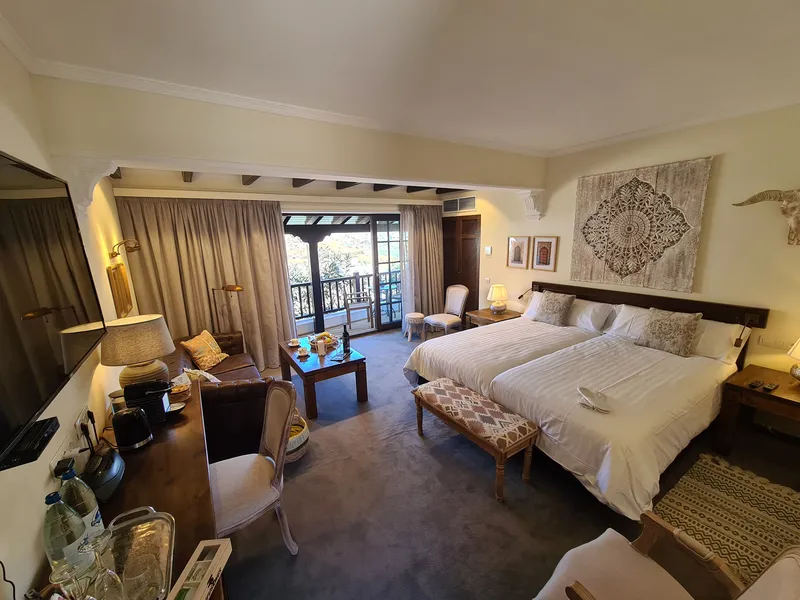The room from the door: the beds, the sofa corner and the terrace doors