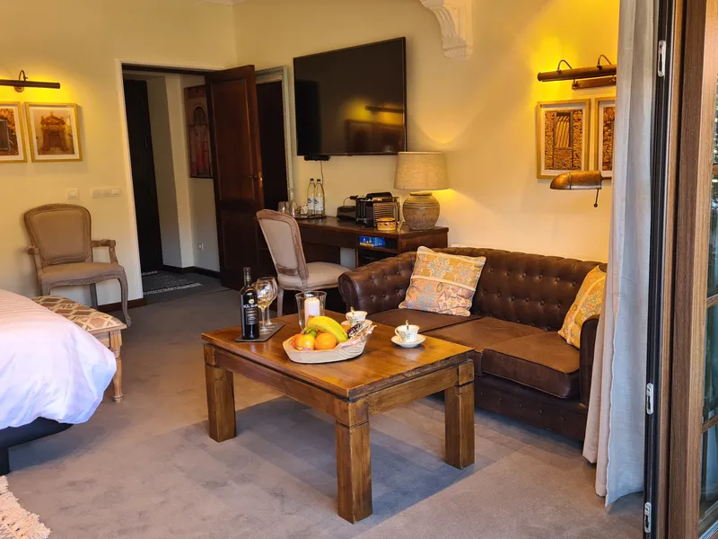 The sofa corner with a coffee table and a bowl of fruit