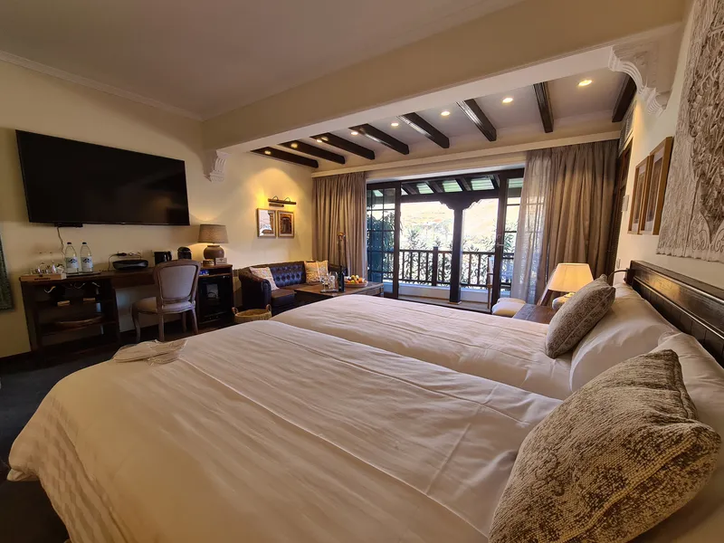 The beds, the desk and the doors to the terrace