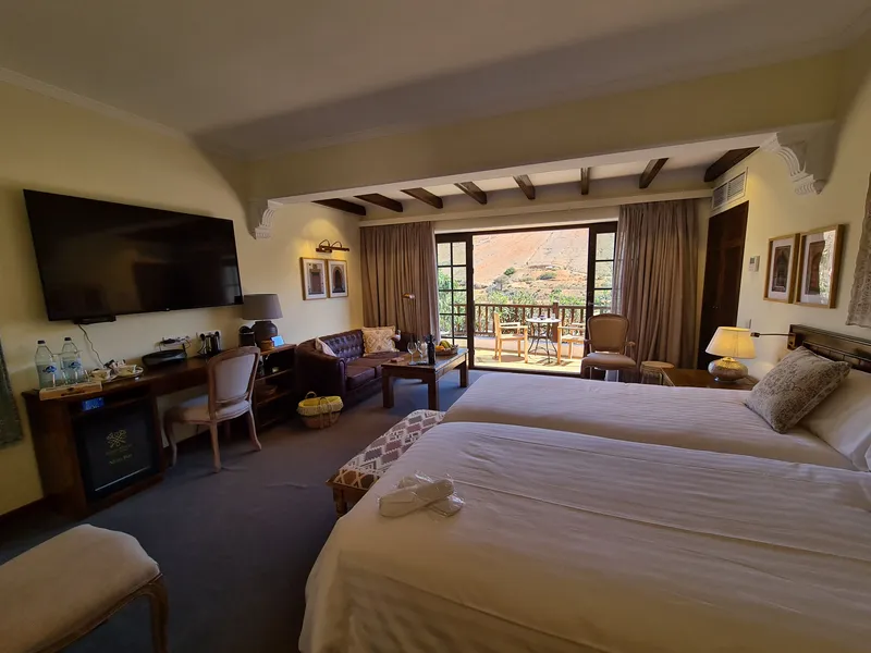 The beds, the desk and the open doors to the terrace