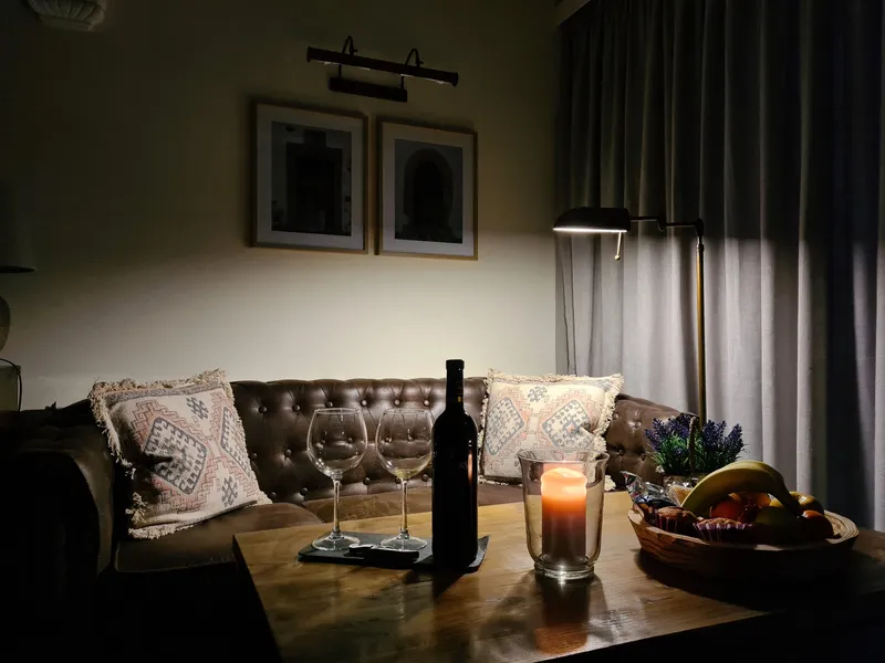 Evening on the leather sofa, with wine and a candle